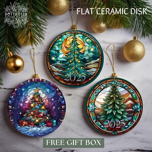 May include: Three flat ceramic disk Christmas ornaments with colorful stained-glass designs. Each ornament features a Christmas tree and the year 2025. The ornaments are round with a gold string for hanging. The text "FLAT CERAMIC DISK" is at the top.