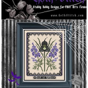 May include: A cross stitch pattern featuring a black and green Dracula Orchid and Wolfsbane plant with purple flowers. The pattern is framed in a black frame with a white background and the text "Dracula and Wolfsbane" is printed below the image. The pattern is designed by GrandmabeWilain for GothStitch.com.