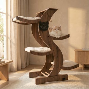 May include: A wooden cat tree with multiple platforms and a curved design. The tree features soft, white cushions for the cat to rest on. A fluffy cat is sitting on one of the platforms. The tree has the text "W.L.O." on it.