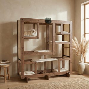 May include: A multi-level cat tree made of dark wood, featuring multiple platforms with soft, white cushions. A cat rests on one of the platforms. The cat tree has a unique, geometric design and a cat-shaped logo.