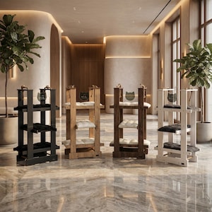 May include: Four wooden cat trees in black, natural, brown, and white. Each has multiple levels with plush cushions and a cat silhouette logo. The trees are in a modern, well-lit space with plants.