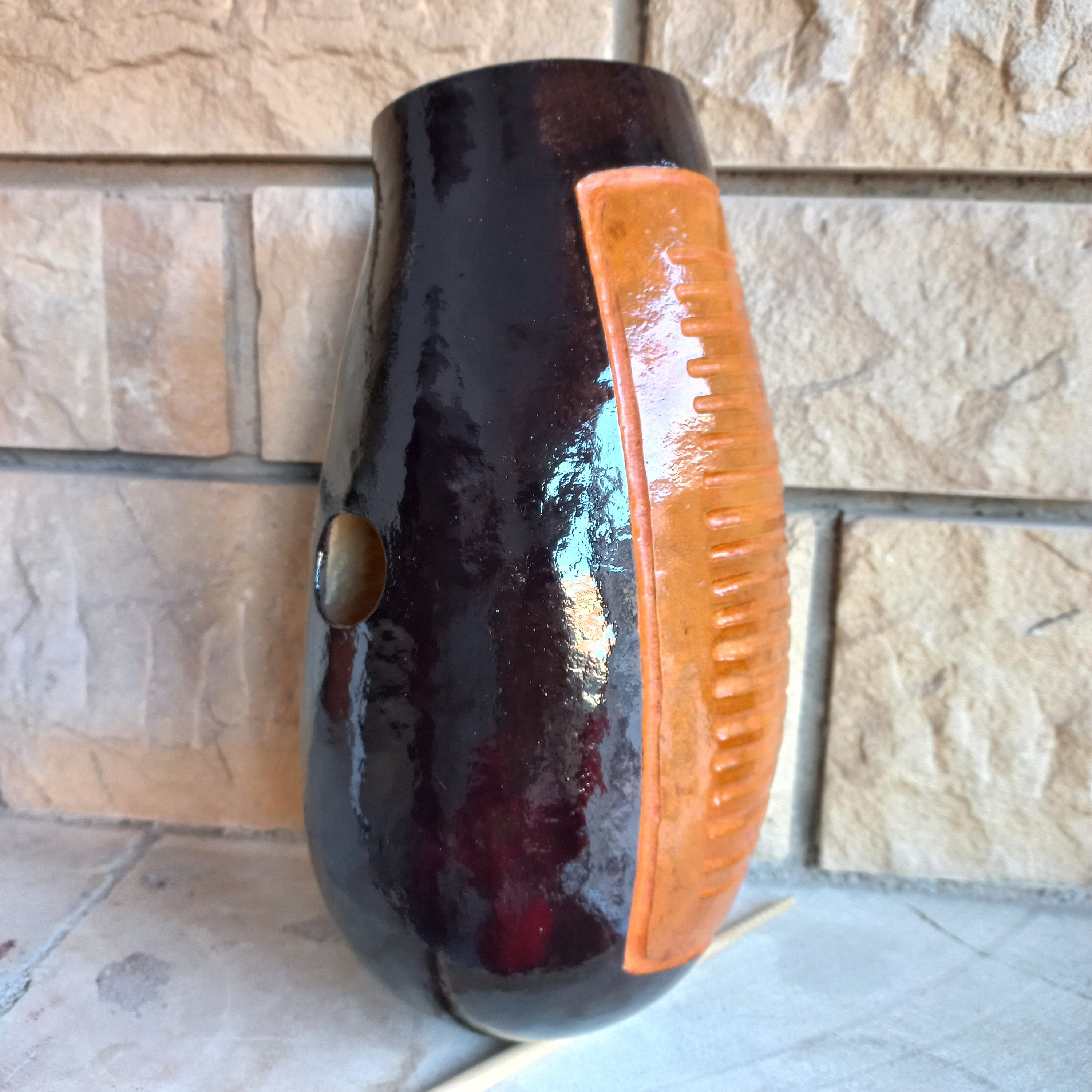 The Guiro is a percussion instrument, traditionally made from