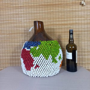 May include: A rustic wooden sign with the text "Welcome to our home" in white lettering. The sign features a distressed finish and a simple, inviting design, perfect for front door decor.