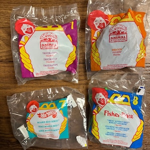 Happy Meal McDonald’s~4 Toys W/ Dinosaurs & Car