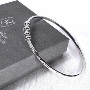 Sterling Silver Bangle Bracelet, Hammered Silver Bangle with Ring Charms, Charm Bracelet, Fidget Jewellery, Birthday Bangle with Charms 4 Rings