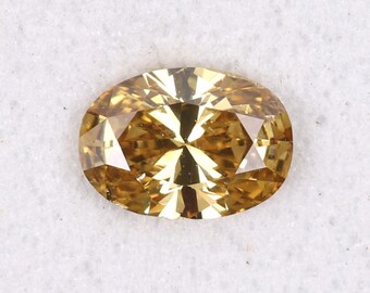 May include: An oval-shaped, golden-yellow gemstone with multiple facets. The gem has a brilliant cut, reflecting light to create a sparkling effect. The stone is set against a white background.