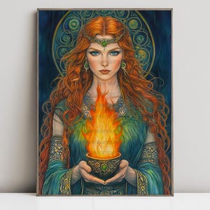 May include: A framed art print of a woman with long red hair, blue eyes, and a green and gold headpiece. She holds a bowl of fire. The background is dark blue with a gold circular design.