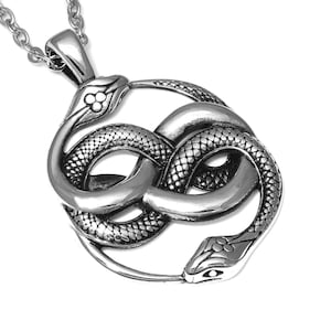 May include: Silver pendant necklace featuring a detailed design of two intertwined snakes forming a circle. The snakes have textured scales and intricate details.