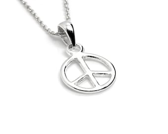 May include: A silver peace sign pendant necklace. The pendant is a simple, circular design with a peace sign cut out in the center.