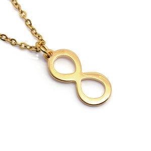 May include: A gold infinity symbol necklace with a delicate chain.