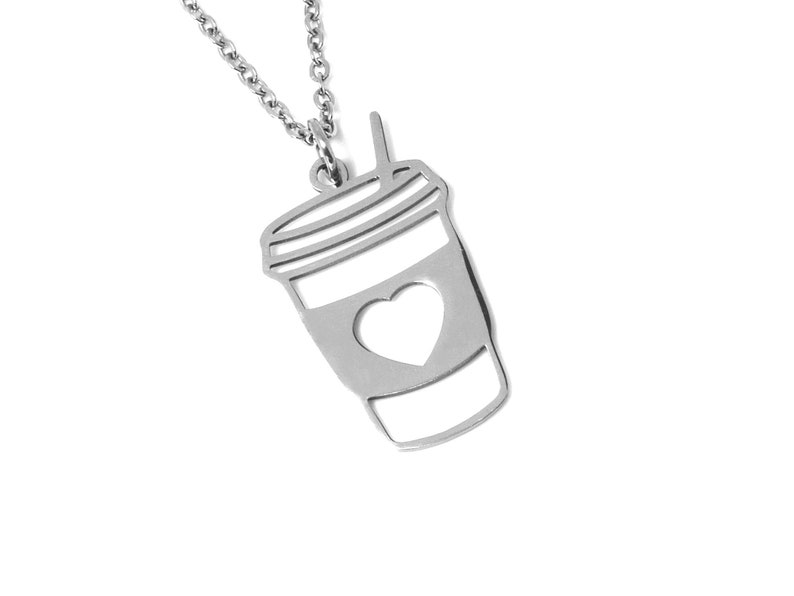 May include: Silver necklace with a coffee cup pendant featuring a heart cutout.