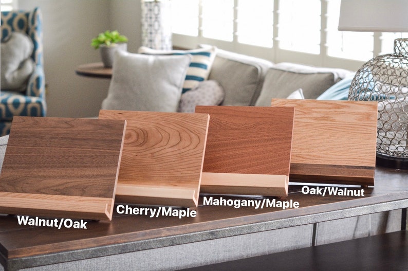 May include: Four wooden display stands with different wood grain patterns. The stands are labelled "Walnut/Oak", "Cherry/Maple", "Mahogany/Maple", and "Oak/Walnut".