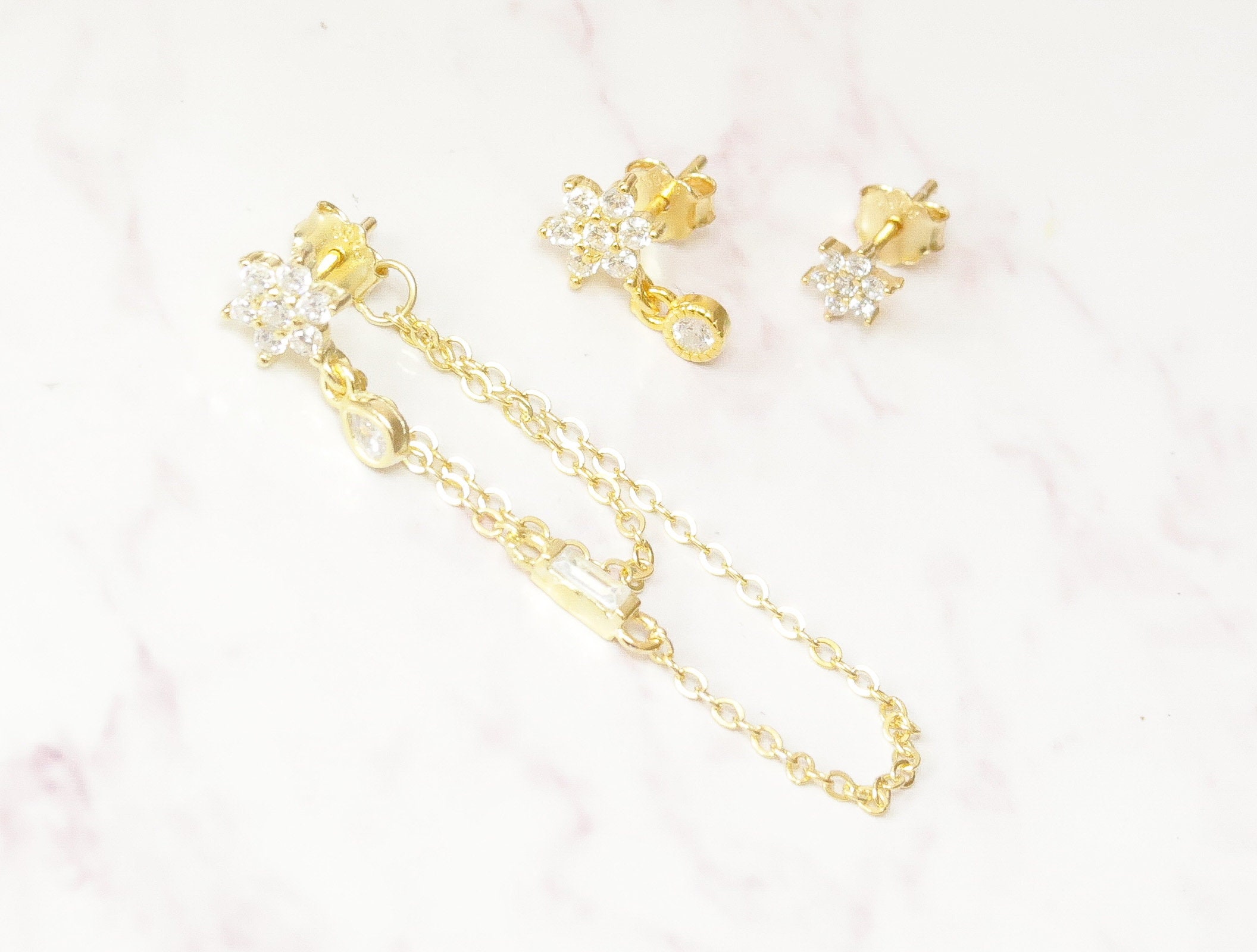 Set of 3 Gold Tone Earrings Featuring Butterfly and Flower Studs -  Approximately 0.2-0.5 L, 261581