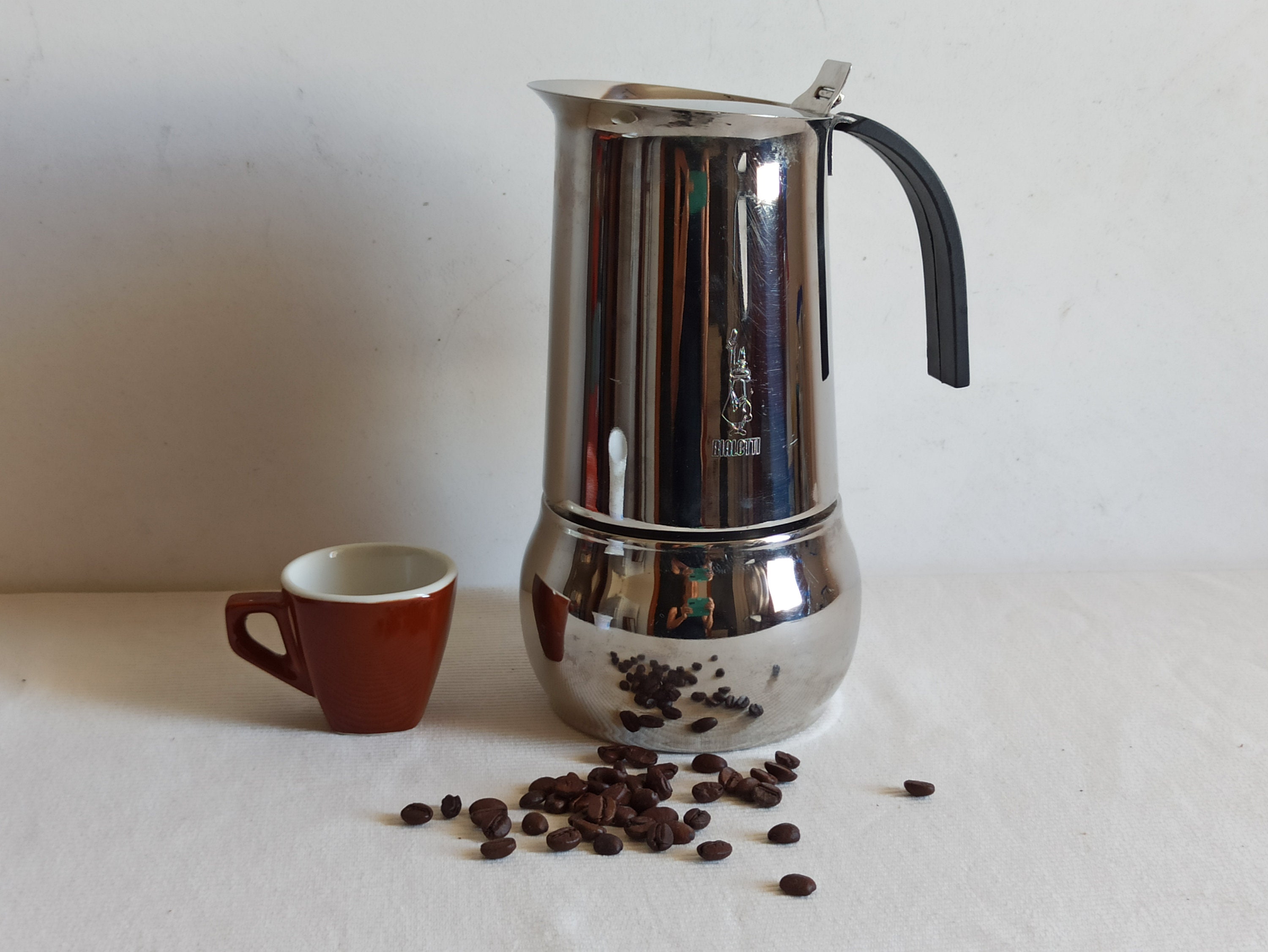 Vintage Bialetti Stovetop Espresso Coffee Pot and Five Black Porcelain Cups  with Metal Holders