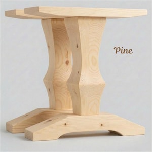 May include: A light-colored pine table base with a rectangular top and two curved support legs. The base has a sturdy, handcrafted appearance, with the word "Pine" in a brown script.