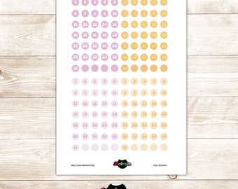 May include: Two sheets of stickers with 31 pink and orange circles, each with a number from 1 to 31 printed in white.