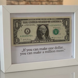 1 US Dollar im Rahmen (weiß) Bild Geld Geschenk Geburtstag Spruch