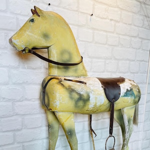 Old large wooden horse on wheels | vintage brocante