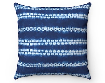 May include: Blue and white striped throw pillow with a tie-dye pattern. The pillow is made of a soft, comfortable fabric and is perfect for adding a touch of style to any room.