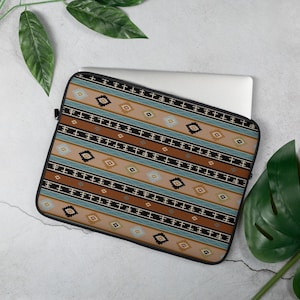May include: A laptop sleeve with a geometric pattern in shades of brown, blue, and beige. The pattern features repeating lines and diamonds.