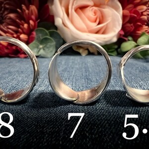 May include: Three silver rings of different sizes, laid out on a blue denim background. The rings are labeled with their sizes: 8, 7, and 5.5.