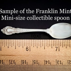 May include: A silver spoon with an ornate handle, measuring approximately 6.5 inches long. The spoon is labeled "Sample of the Franklin Mint Mini-size collectible spoon".