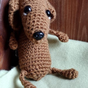 Handmade Amigurumi Dachshund dog keychain.