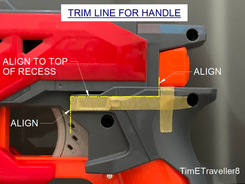 May include: Close-up of a red and gray toy gun with orange accents. The image includes text that reads "TRIM LINE FOR HANDLE" and "ALIGN". Yellow tape is used to mark alignment points. The image is a detailed guide for assembly or modification.