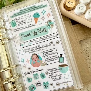 May include: A clear plastic budget planner insert with the words "Treat Yo' Self" and various illustrations. The insert includes sections for tracking spending and savings, with gift box and ice cream cone graphics. A calculator is in the background.