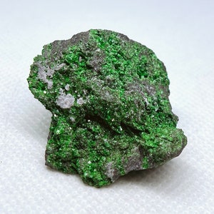 Natural Uvarovite (Green Garnet) crystals on Chromite matrix from Ural Mountain, Russia.