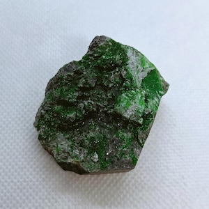 Natural Uvarovite (Green Garnet) crystals on Chromite matrix from Ural Mountain, Russia.