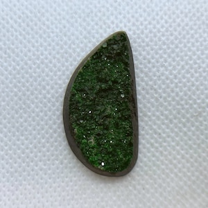 Natural Uvarovite (Green Garnet) cabochon with crystals on top from Ural Mountain, Russia.