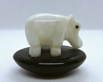 Hand Made Hippopotamus carved from White Quartz on Obsidian base.