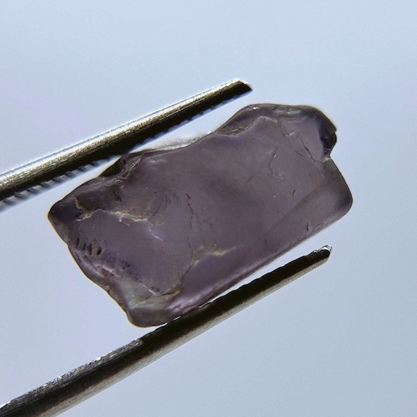 Natural gray-purple spinel gem rough crystal from Burma.