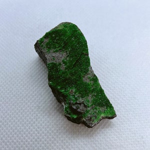 Natural Uvarovite (Green Garnet) crystals on Chromite matrix from Ural Mountain, Russia.