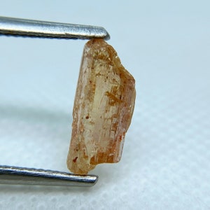 Natural rough Imperial Topaz crystal from Brazil.