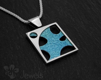 Silver pendant with light blue enamel in a frame. Textured silver and enamel pendant. Contemporary art pendant