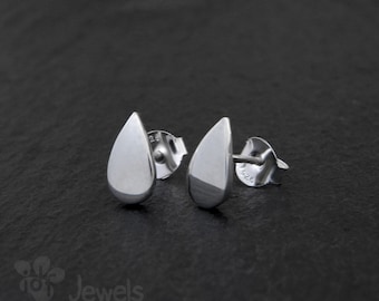 Small button earrings made of silver with teardrop shape. Little drop. Handcrafted jewel