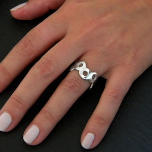 Ring made of silver. Exotic and eye-catching silver ring. Ring with circles. Modern ring. Handcrafted jewel