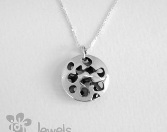 Small pendant made of silver with volume. Aged silver. Round pendant. Handcrafted jewel