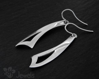 Long and elegant earrings made of silver. Geometric design. Dangle earrings. Handmade jewel