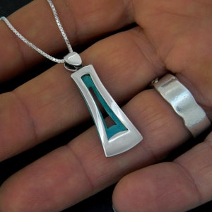 Pendant made of silver with volume and light green enamel inside. Colorful. Elegant pendant. Silver and enamel pendant. Handmade jewel
