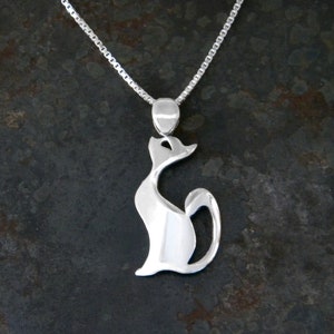 Cat pendant made of silver.Silver pendant in the shape of a kitten. Delicate and elegant pendant. Handmade jewel