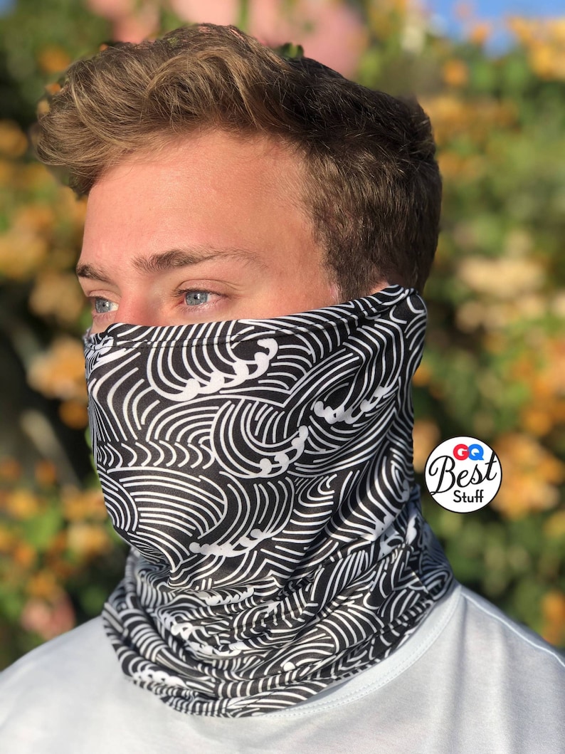 May include: A black and white face mask with a wave pattern. The mask is made of a soft, breathable fabric and is comfortable to wear. The mask is perfect for protecting yourself from dust, pollen, and other airborne particles.
