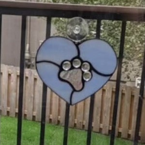 Stained glass sympathy heart with choice of color background and dog print.  Laser Engraving Available!