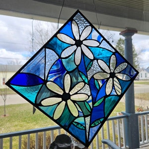 Stained glass daisies.  12 1/2" x 12 1/2" - choice of daisy and background colors!