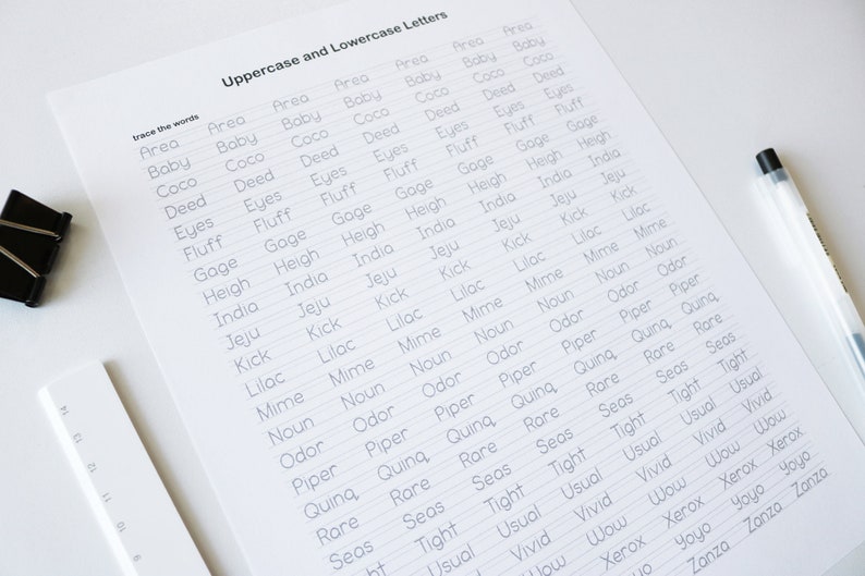 May include: A worksheet with the words "Uppercase and Lowercase Letters" at the top. The worksheet has a list of words in alphabetical order, starting with "Area" and ending with "Zanza". Each word is written twice, once in uppercase and once in lowercase. The words are written on lined paper.