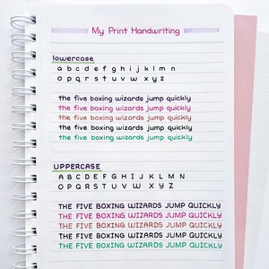May include: A white notebook with a spiral binding. The page is filled with handwritten lowercase and uppercase letters in different colors. The text "the five boxing wizards jump quickly" is written in five different colors. The text "pen: Sakura Pigma Micron" and "notebook: Poppin. (medium pocket notebook)" is written at the bottom of the page.