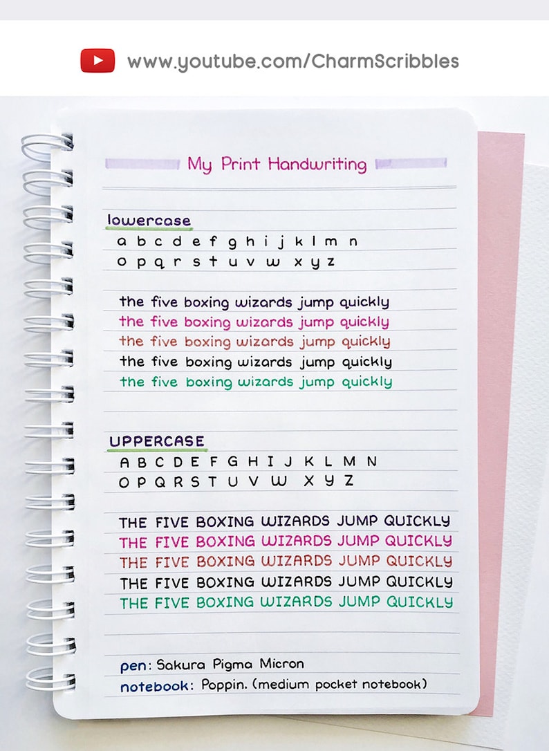 May include: A white notebook with a spiral binding. The page is filled with handwritten lowercase and uppercase letters in different colors. The text "the five boxing wizards jump quickly" is written in five different colors. The text "pen: Sakura Pigma Micron" and "notebook: Poppin. (medium pocket notebook)" is written at the bottom of the page.