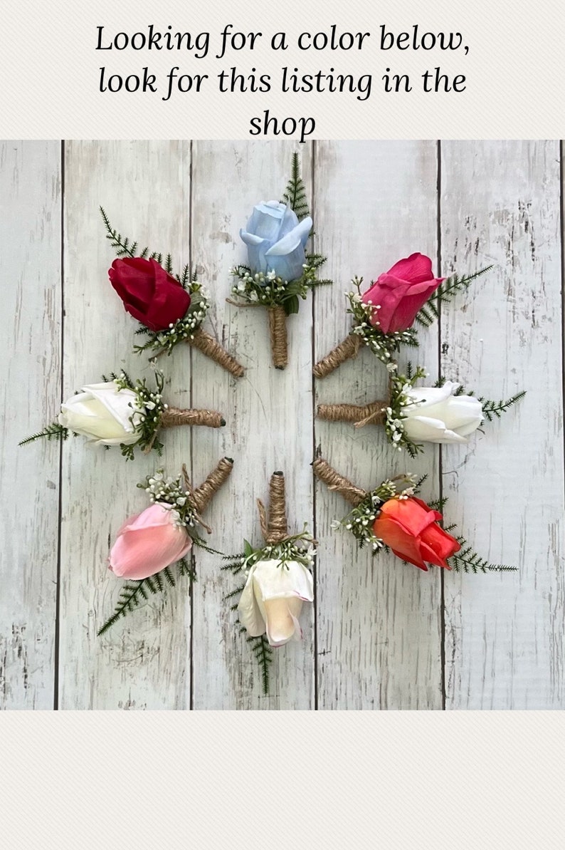 May include: Eight artificial rose buttonholes in various colours, including white, pink, red, coral, and blue. Each buttonhole is tied with twine and features small green leaves.